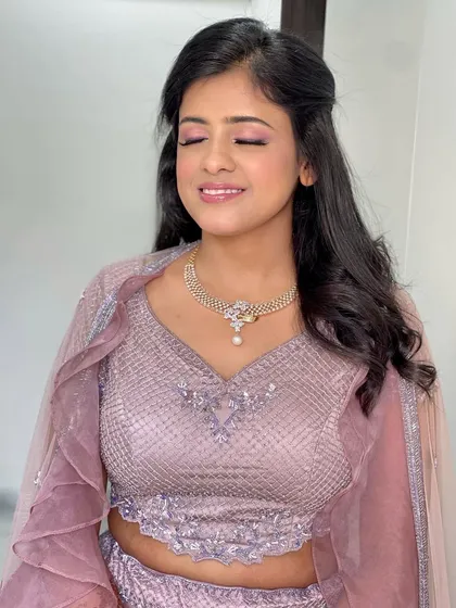 All dolled up for her engagement ceremony. This bride's pastel purple lehenga was paired with a soft pink eyeshadow and a glowing base. 💕