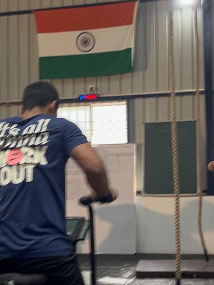 An athlete pushing through the pain on the assault bike during The Bengaluru Throwdown. It's all about getting it done.