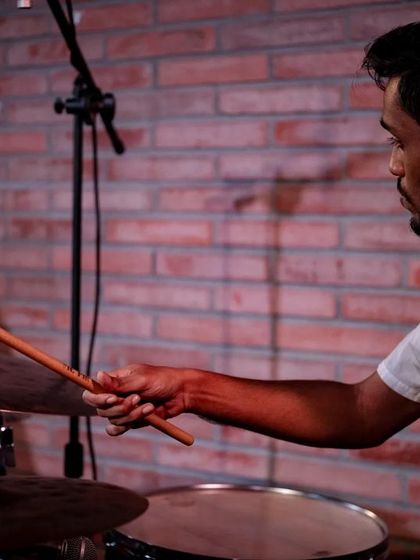 A close-up of drummer Rohit PS during the REFUGE performance at the Jazz Festival. The image highlights the precision and energy he brings to the ensemble.