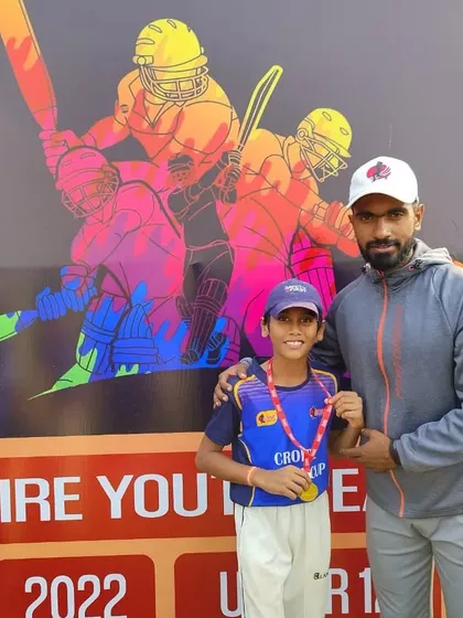 Ayan Khandelwal receiving the best bowler award.