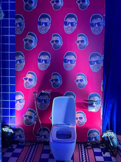 Another shot of the quirky, personalized bathroom wallpaper.