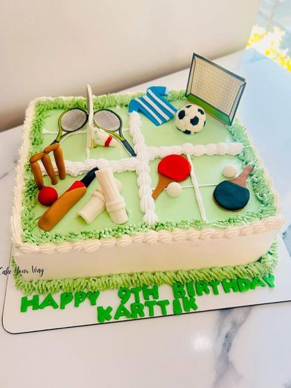 A cake for the ultimate champ, featuring cricket, football, badminton, and table tennis.