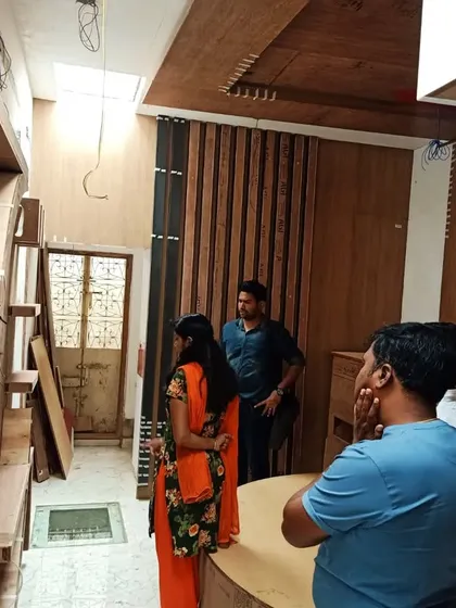 Our team discussing progress with the on-site contractors. Regular visits and clear communication are key to ensuring the execution matches our design intent perfectly.