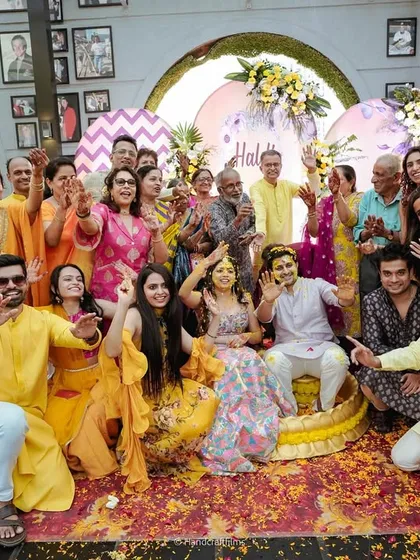 A happy group photo with the couple and their loved ones after the Haldi ceremony. It's a celebration of family, friendship, and new beginnings.