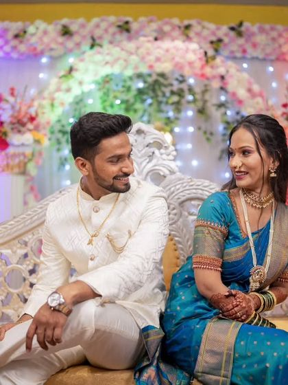 A sweet moment of conversation between the couple on their engagement stage.