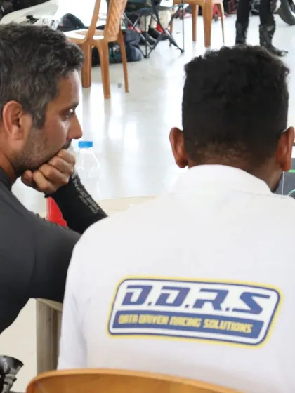 Another shot of me analyzing track data with a telemetry expert. We are always looking for new ways to help our students unlock their potential.