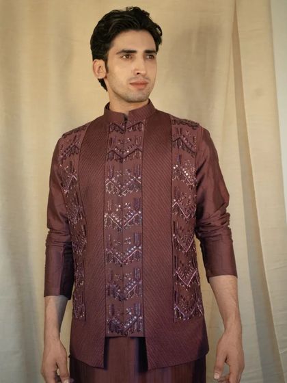 The rich silk fabric drapes beautifully, while the meticulously crafted embellishments add a touch of opulence to your ensemble.