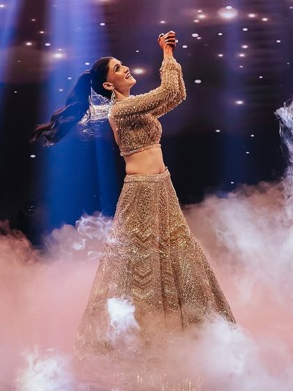 A dreamy solo performance for our bride Prerna. We used low-lying fog and dramatic backlighting to create this ethereal moment, making her look like she was dancing on clouds.