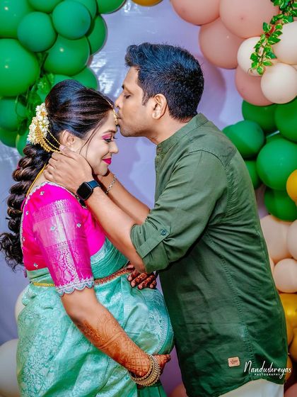 A tender kiss on the forehead is a powerful symbol of love and protection. We captured this intimate moment between the couple during their baby shower, a memory that perfectly encapsulates the emotion of the day.