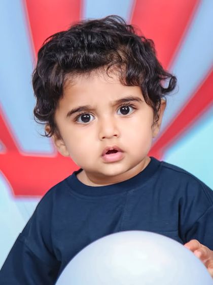 A charming 'Baby Shark' themed birthday party, featuring a vibrant underwater backdrop, character cutouts of the shark family, and blue and yellow balloons, perfect for a fun-filled celebration.