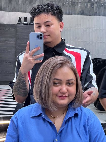 A friendly reminder to book your appointment for a fresh new look, like this chic and modern ash blonde bob.