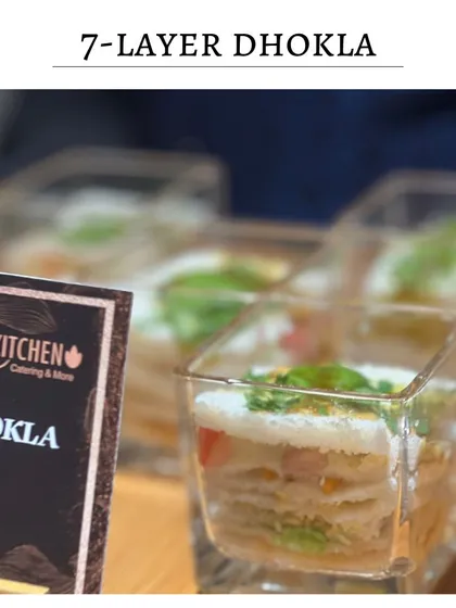 My signature 7-Layer Dhokla, presented in elegant glass cubes. This dish deconstructs the classic Gujarati snack into a visually stunning and flavorful bite.
