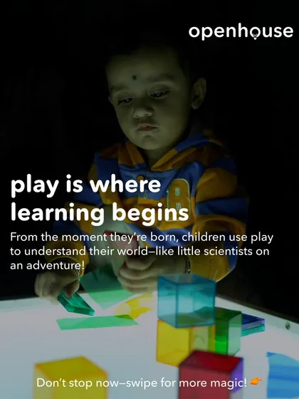 We believe play is where learning begins. From the moment they are born, children use play to understand their world, acting like little scientists on an adventure. Here, a child explores light and color, a fundamental sensory experience.