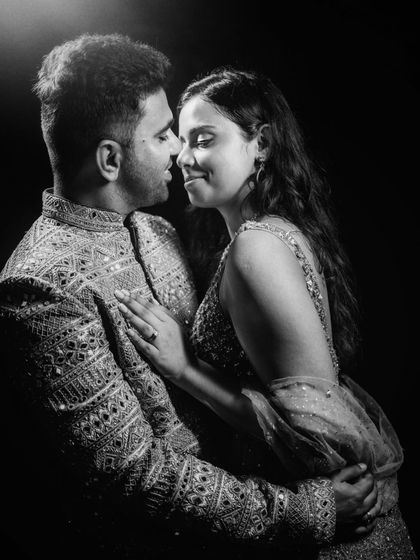 A classic, timeless black and white portrait. The close-up shot focuses on their connection and emotion.