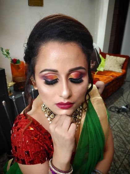 A creative and colourful eye makeup look with sunset tones of orange and pink. This is perfect for a client who wants something unique.