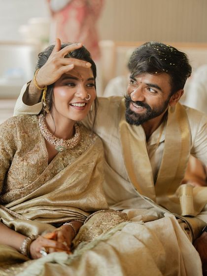 A playful and happy moment from a housewarming ceremony. The makeup is designed to look beautiful and last through all the joyful moments of the day.