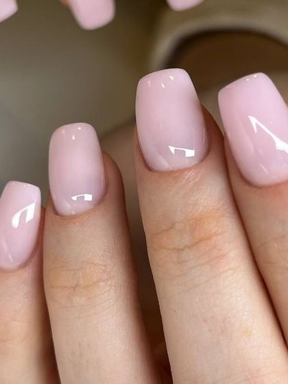 A soft, milky pink BIAB manicure. This provides strength to the natural nail while giving a clean, polished, and effortlessly chic look.