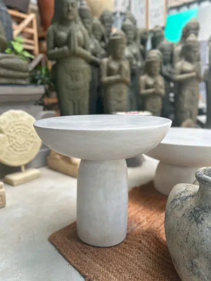 A taller version of our minimalist stone side table. Its sleek, sculptural form makes it a piece of art in its own right, perfect for placing next to a chair or as a stand for a beautiful vase.