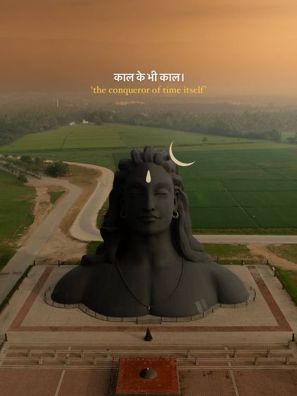 The Adiyogi statue, described as 'the conqueror of time itself,' captured against a serene landscape.