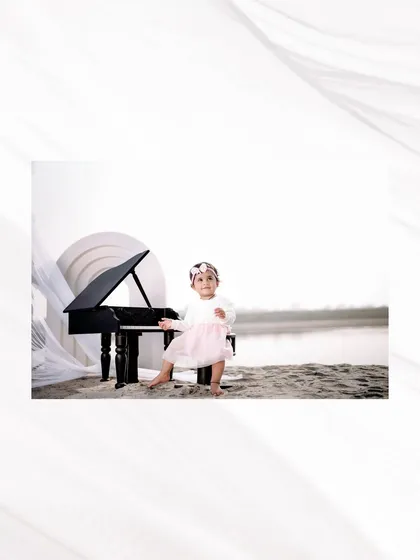 A beautiful portrait of a little musician by the water. The clean, bright lighting and simple setup create a timeless and elegant feel.