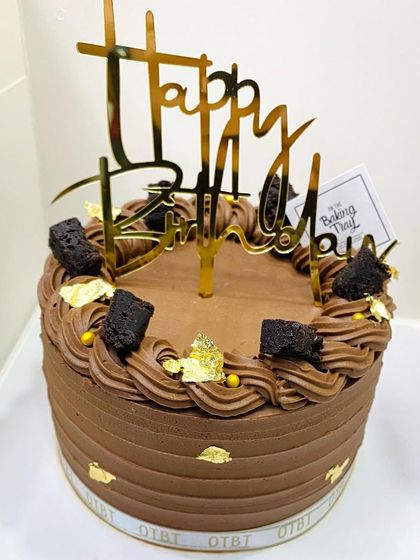 The full view of the delicious Billionaire Cake, ready for a birthday celebration.