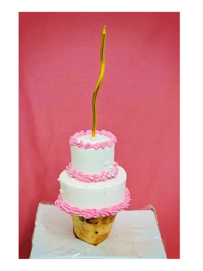 My first attempt at the trending ice cream cone cake. This is a two-tier chocolate truffle cake that looks like it's balancing on an ice cream cone.
