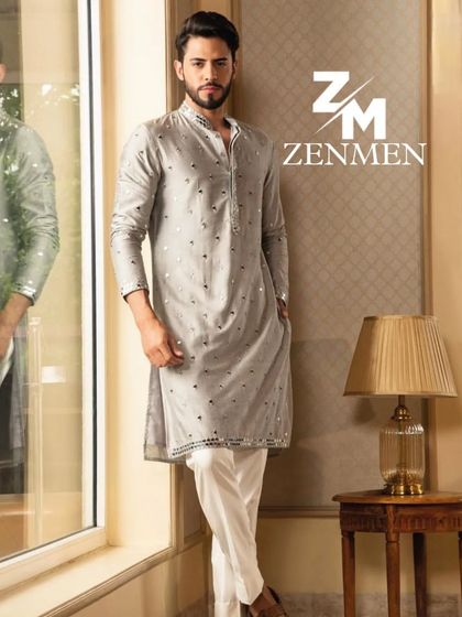 This grey kurta features a modern, minimalist pattern with mirror work accents. It's a great example of how I blend traditional crafts with contemporary design.
