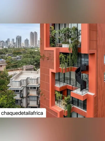 The sculptural black spiral staircase provides both a functional and aesthetic link between the green terraces of the Sarvasva tower, encouraging movement through the outdoor spaces.