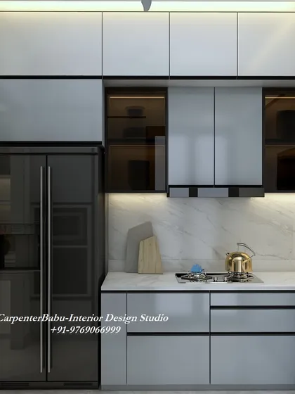 A modern kitchen with grey cabinets and a built-in refrigerator and oven. The design is sleek and efficient, with a marble-finish backsplash adding a touch of luxury.