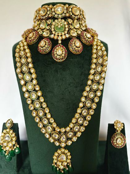 A full view of a grand Polki and Kundan bridal set with a long necklace and matching earrings. This is one of my premium rental pieces.
