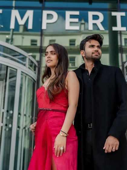 A confident and stylish pose in front of the glass facade of a modern London building. This shot has a strong, editorial feel, perfect for a contemporary couple.