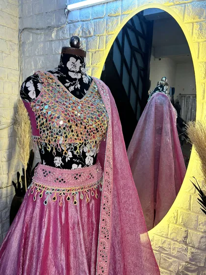 The way the light reflects off the mirrors is just magical. This lehenga is designed to make you the center of attention.