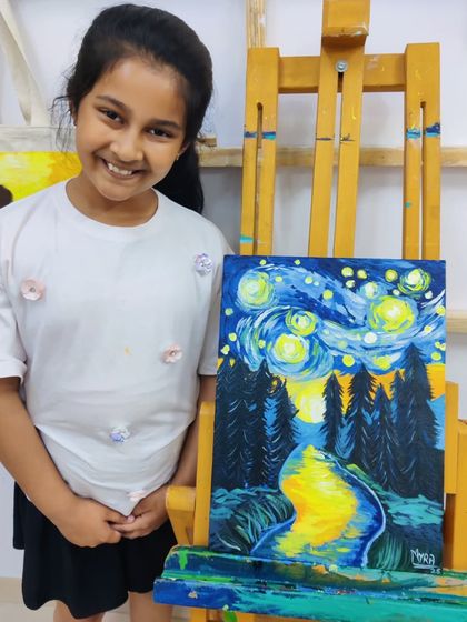 A young student recreates Van Gogh's "Starry Night," learning about impressionistic style and bold color application.