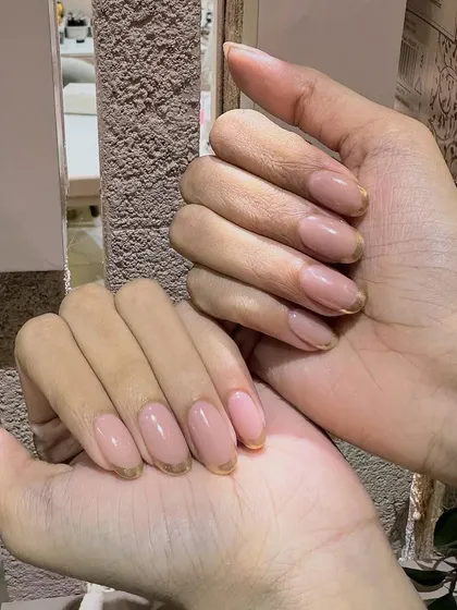 Valentine's vibes with a touch of glam. Our gold chrome French nails are perfect for feeling luxurious and special.