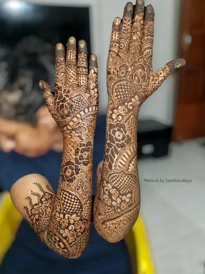 Showcasing the complete bridal henna for Sanaya, with full coverage from fingertips to elbows.