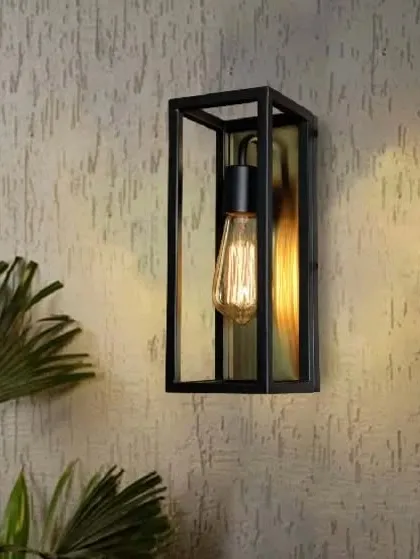 This wall lamp exudes nostalgic vibes with its black rectangular frame and brushed gold interior. The design is perfect for showcasing a vintage Edison bulb, adding a touch of industrial-chic to your decor.