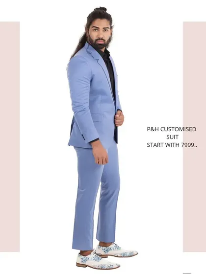 A side profile of the sky blue suit, showing its slim and contemporary tailoring.