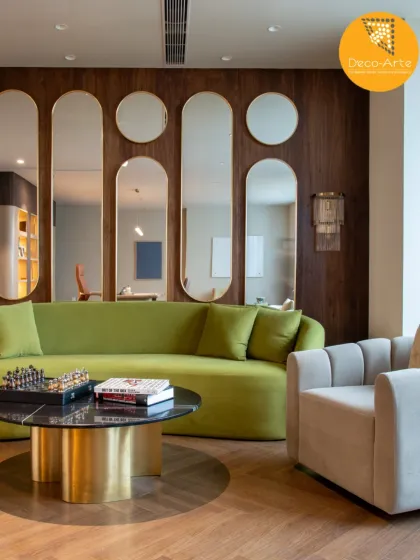 The lounge area at the Brandman project, where comfort meets character. We used a mix of organic textures, playful geometry in the mirror arrangement, and a pop of color to redefine the modern corporate lounge.