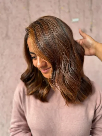 A happy bride-to-be with her fresh brown balayage. The color adds warmth to her complexion and the soft waves give a romantic feel.