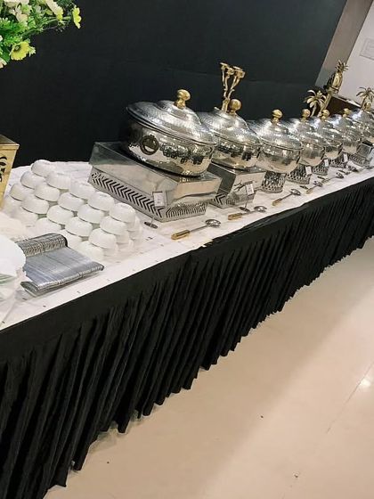 A sleek, professional buffet setup for a corporate event of 150 guests for Encedo Inc. I provide complete end-to-end service, from food and presentation to my experienced staff.