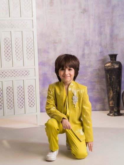 A different pose showing the bright yellow sequined Indo-western outfit. I can customize this design in any color to match your wedding's theme.