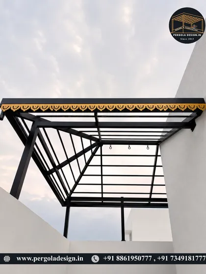 A view from below of the black pergola frame, showing the clean lines and sturdy construction before the roof is added.
