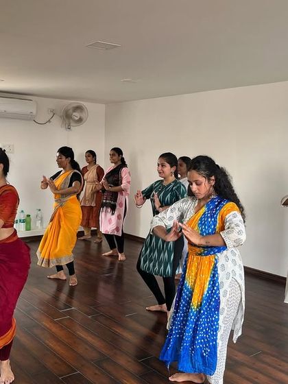 Participants practicing adavus during the Chennai workshop. The focus is on refining basic footwork and body movements in a group setting.