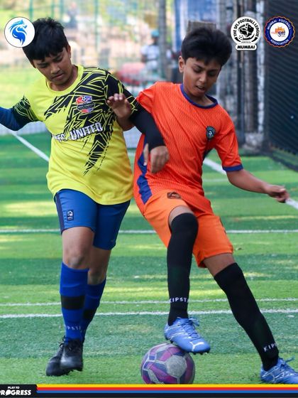 A player uses his body to shield the ball effectively. This tactical awareness is a key part of our coaching.