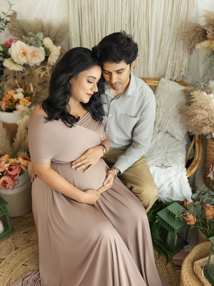 An intimate moment between a couple, seated together in our cozy boho corner. Their connection and shared joy are beautifully captured in this shot.