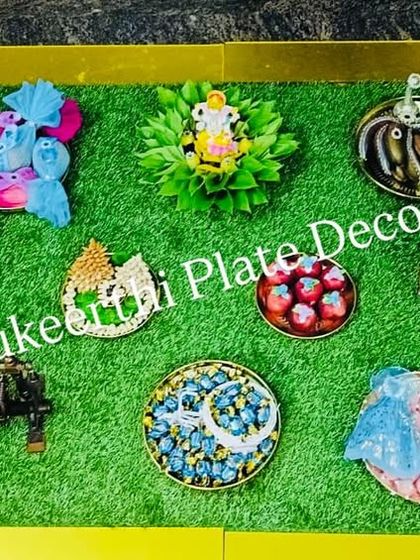 A top-down view of a baby shower platter arrangement in Saravanampatti. This shows the variety of items and the creative way they are presented.