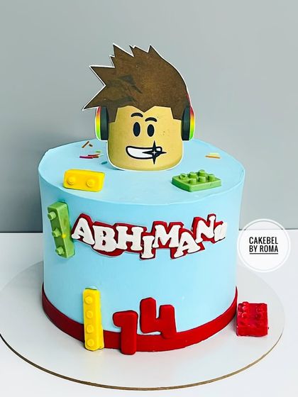 Game on. A fun cake for a 14-year-old gamer who loves Roblox and LEGO. The design is bright, colorful, and features his favorite avatar.