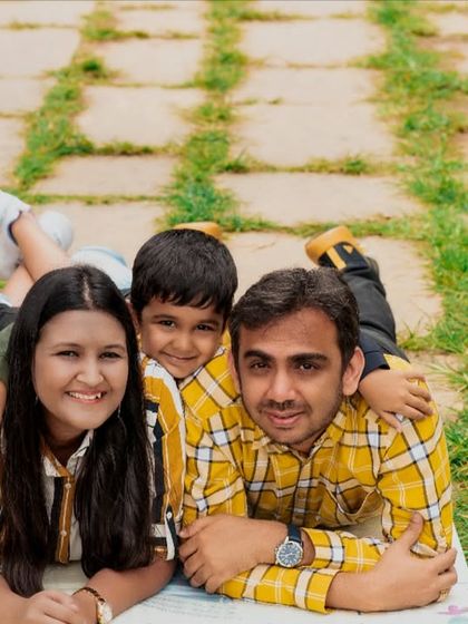 Another angle from the fun family stack. This shot captures everyone's smiles and the joyful, relaxed atmosphere of the outdoor photoshoot.