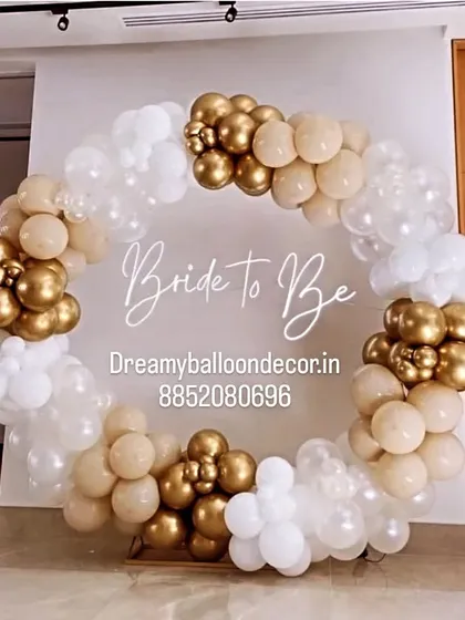 An elegant and sophisticated 'Bride to be' backdrop. I used a neutral color palette of nude, white, and gold balloons to create a full circular arch, perfect for a classy bachelorette party or bridal shower.