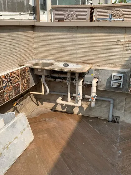 A look at the plumbing and structural work for an outdoor terrace sink before the final finishing is done.